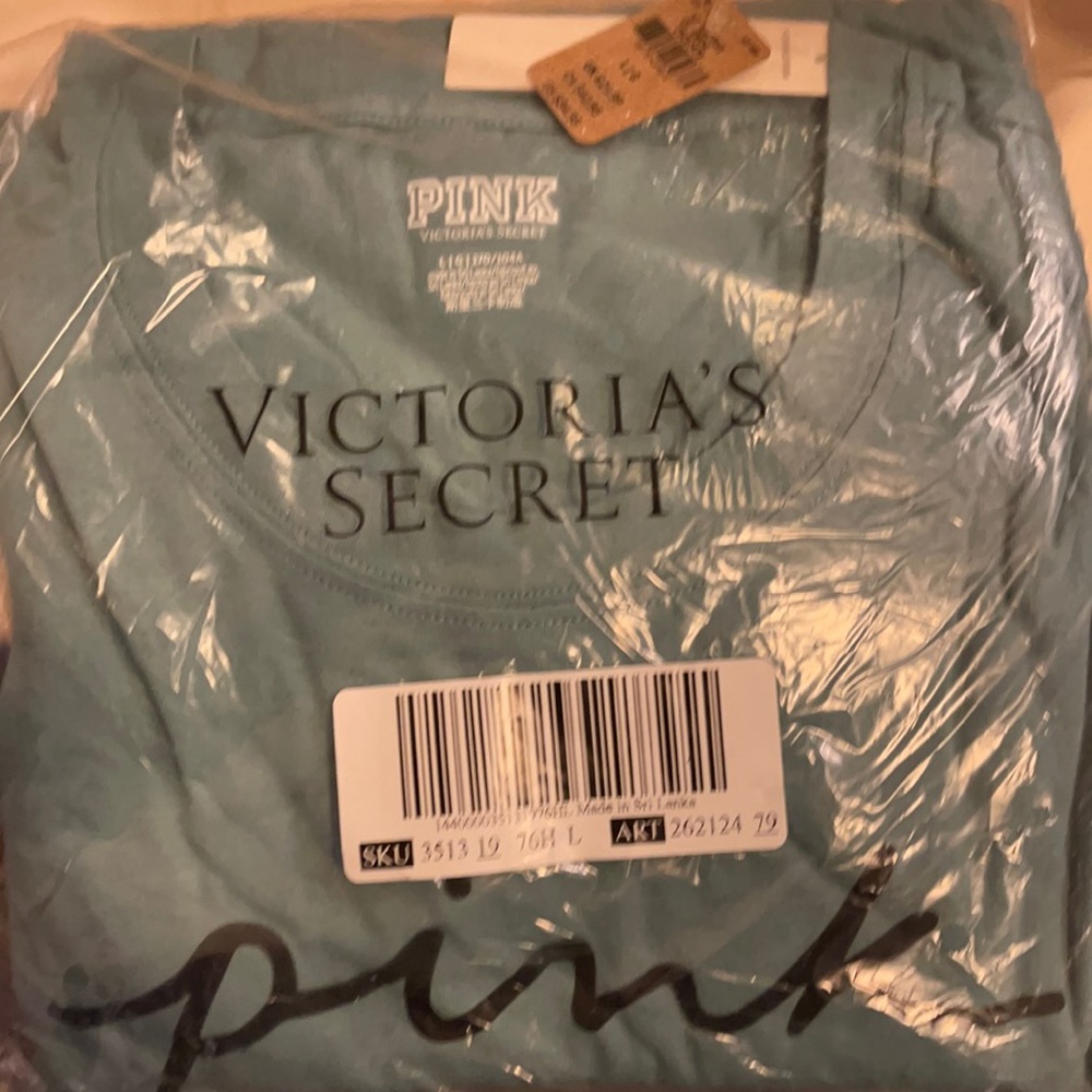 Brand new pink shirt color sage brand new still in bag. Size large.